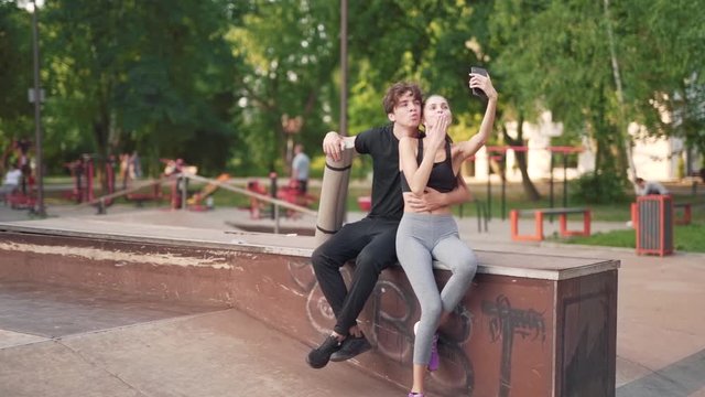 Young Attractive Couple Outdoors Taking A Selfie Together