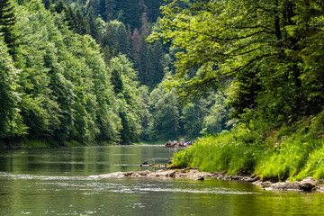 Floating along Dunajec river in Pieniny National Park, Poland, Dunajec river - popular tourist spot for boat rafting in Poland