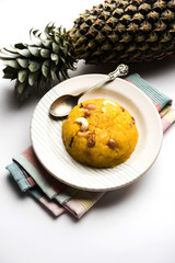 Pineapple sheera or Halwa also known as Ananas keshri shira. Popular South Indian Dessert recipe. selective focus