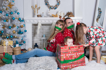 Merry Christmas and Happy Holidays! Xmas Christmas photo of surprised happy family. daughter...