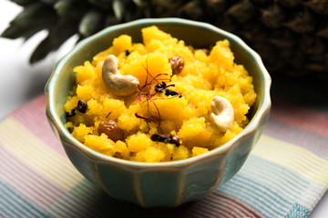 Pineapple sheera or Halwa also known as Ananas keshri shira. Popular South Indian Dessert recipe. selective focus