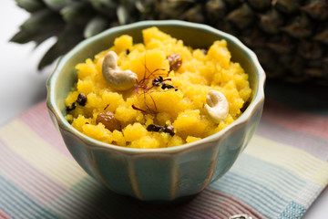 Pineapple sheera or Halwa also known as Ananas keshri shira. Popular South Indian Dessert recipe. selective focus