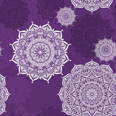 Seamless vector pattern with lace mandalas on a purple background.