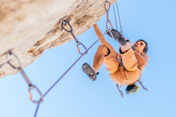 Man climbing a rock.