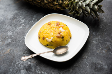 Pineapple sheera or Halwa also known as Ananas keshri shira. Popular South Indian Dessert recipe. selective focus