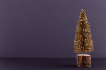 Christmas tree on pastel colored background. Christmas or New Year minimal concept.