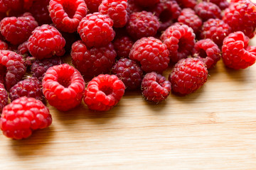 raspberries on wooden background