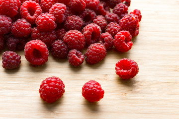 raspberries on wooden background