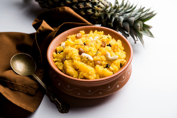 Pineapple sheera or Halwa also known as Ananas keshri shira. Popular South Indian Dessert recipe. selective focus