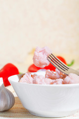 Homemade summer crop preservation, vegetable vegetarian diet wholesome food, natural canned cauliflower with garlic marinated in a white bowl a plate on the table with copy space