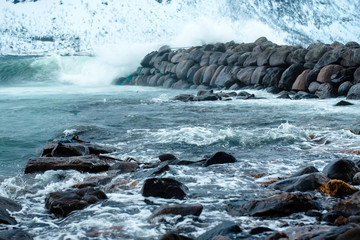 Dramatic winter sea and epic snowy mountains, Lofoten islands in Norway