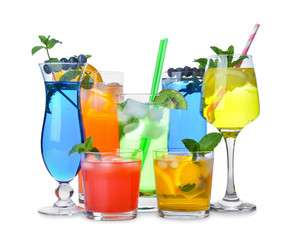 Glasses of tasty summer cocktails on white background