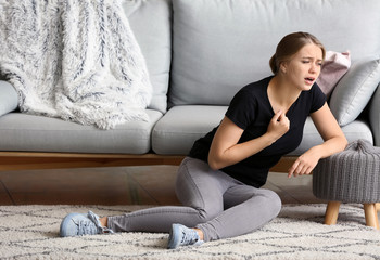 Woman having panic attack at home