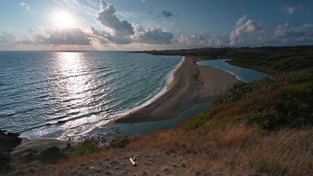 Video with panoramic morning view with one of the most beautiful and wild beaches at the Black Sea coast and the estuary of Veleka river, Bulgaria.