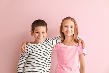 Portrait of happy little children on color background © Pixel-Shot