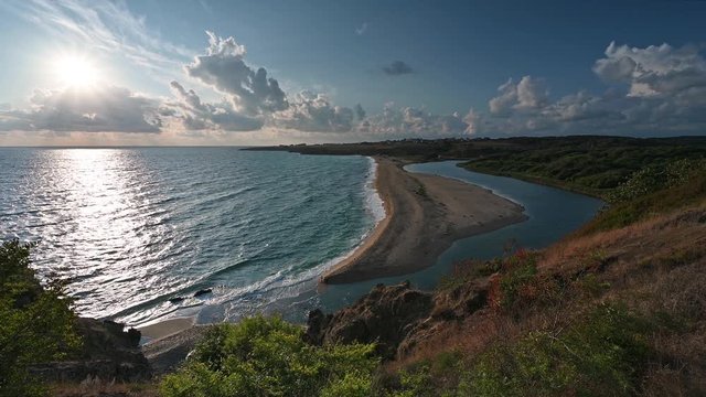 Video with panoramic morning view with one of the most beautiful and wild beaches at the Black Sea coast and the estuary of Veleka river, Bulgaria.