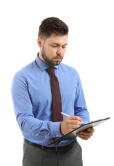 Portrait of businessman with clipboard on white background