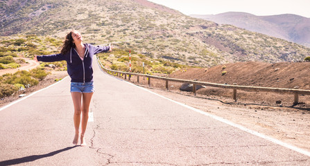 Happy people enjoying the nature and outdoor leisure activity -  beautiful young woman walking in...