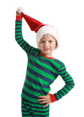 Cute little boy in pajamas and Santa Claus hat on white background