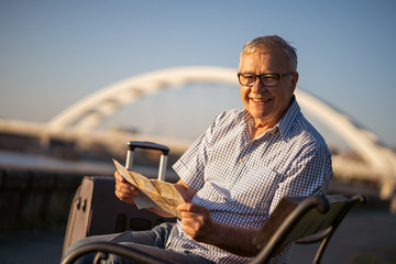 Outdoor portrait of senior man who is on vacation.