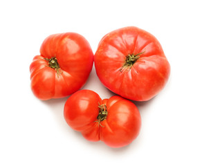 Fresh tomatoes on light background