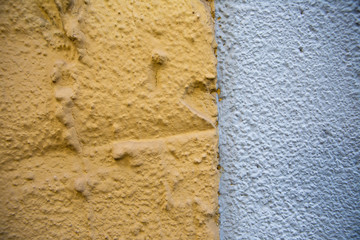 Old red brick wall. Old concrete wall. The facade of the house built of solid stone cement