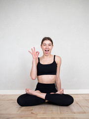 Fototapeta premium Attractive european girl doing yoga exercise