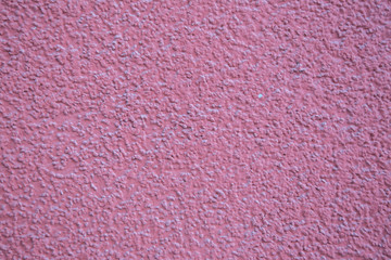 Old red brick wall. Old concrete wall. The facade of the house built of solid stone cement