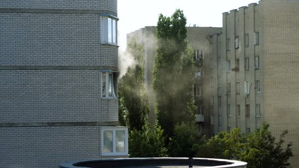Clouds of grey smoke coming from the window of a burning apartment. 4K