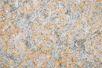 Rough texture of yellow marble as background