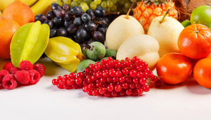 Fresh fruits pile on white