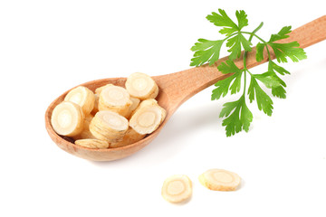 fresh parsley root in wooden bowl isolated on white background