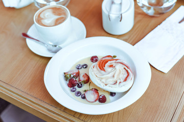 Obraz na płótnie Canvas Beautifully served dessert sorbet with a cup of coffee.