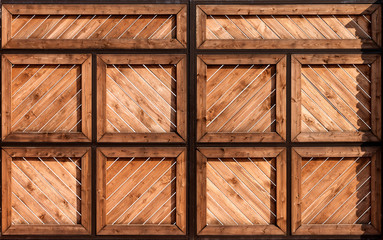 Beautiful antique wooden swinging brown vintage gate. Abstract modern trendy texture background.