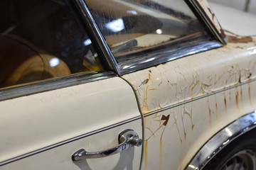 Old vintage rusty car door and rear wheel closeup - 290467530