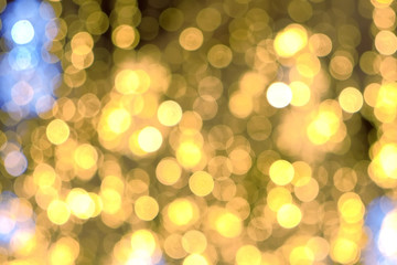 Obraz premium Close-up gold christmas lights blur background Christmas street lights.