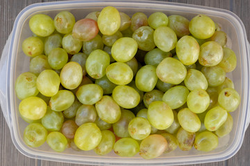 Many green grapes close up. Fruit of the autumn