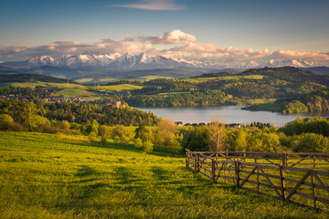 Panorama of snowy Tatra mountains and castle in Czorsztyn during spring sunset, Malopolskie, Poland - 290470101