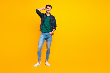 Fototapeta premium Full length body size photo of cheerful handsome man standing confidently in front of camera while on vacation isolated bright color background