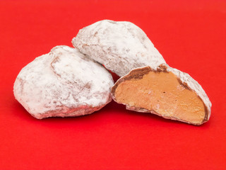 Snowballs with mocha filling on red background