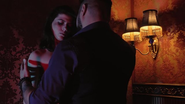 beautiful girl dance striptease for a guest in a private room