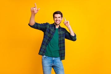 Photo of nice guy crazy dancer indicating fingers to copyspace inviting friends to dance floor wear...