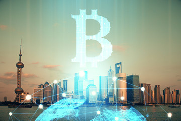 Double exposure of crypto currency theme hologram drawing and city veiw background. Concept of...