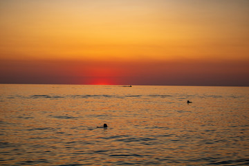 Sunny sunset on a warm and clear sea