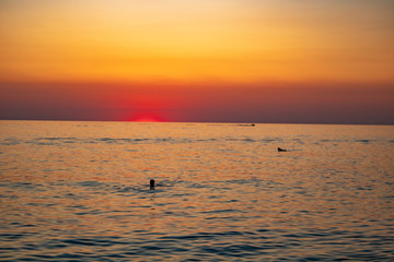 Sunny sunset on a warm and clear sea