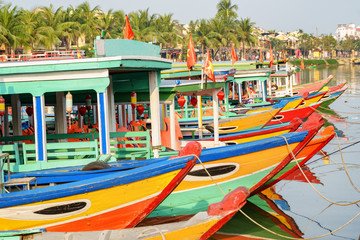 Fototapeta na wymiar Awesome view of colorful traditional Vietnamese tourist boats