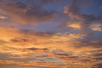 Orange sky background with clouds