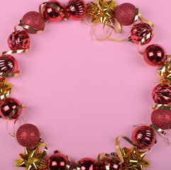 Christmas tree red balls wreath on pink background, background