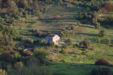 Fototapeta premium Cyprus rocky hills with agriculture, houses and small churches
