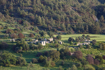 Fototapeta premium Cyprus rocky hills with agriculture, houses and small churches